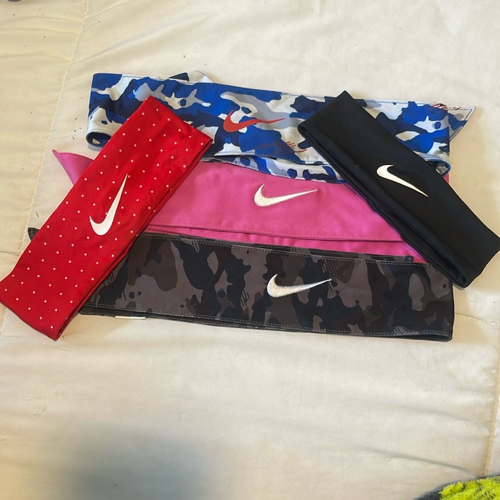 3 tie up hair bands. 2 regular. All Nike